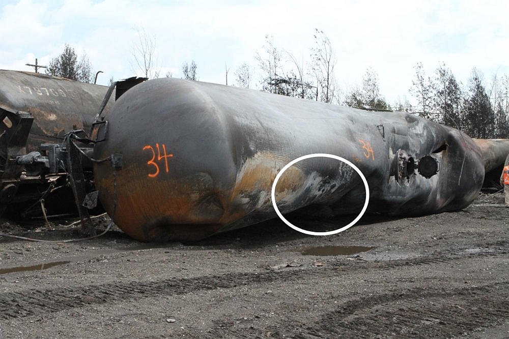 Photograph showing coupon marked on the head of tank car ACFX 76605