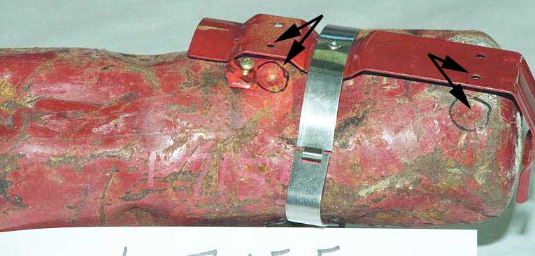 Recovered dry chemical extinguisher - Exhibit 1-7155 - impact marks aligned with bracket