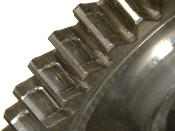 Photo of close up photo of the gear showing wear on the teeth