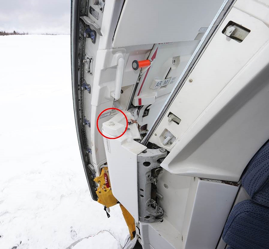 Gust lock release pushbutton (circled) on the L1 door