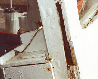Photo of the disintegration due to dry rot of plywood bridge front in way of front door frame