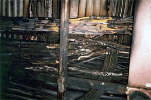 Photo 2. View of burned cabling above deck of engine control room (note effect of heat on copper tubing)