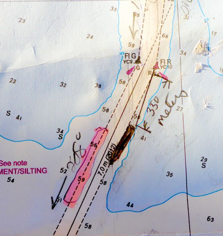 Photo of chart no. 4954 shows the shallow area marked in pink, vessel's aground position, marked in black, added by the crew following the occurrence 