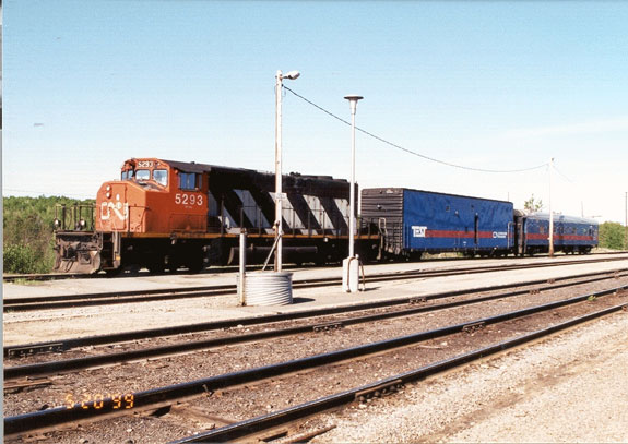 Typical CN TEST train configuration showing freight locomotive, a highly instrumented box car and a dedicated track geometry car