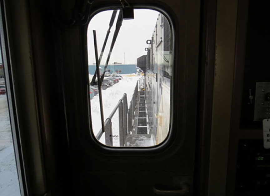 Image of the rear window view behind locomotive engineer