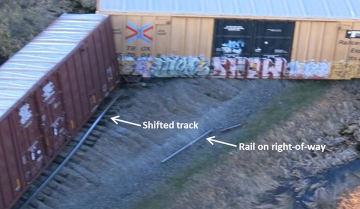 West end of the derailment site showing the shifted track and 2 pieces of rail on right-of-way