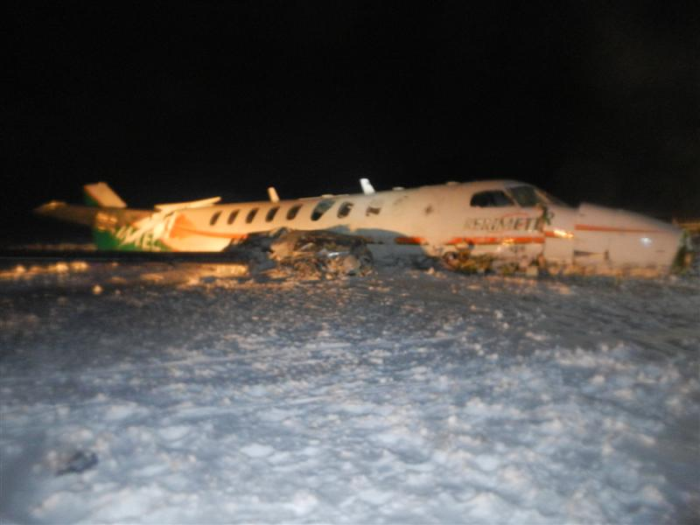Damaged Fairchild aircraft [right side] at Sanikiluaq Airport after accident on 22 December 2012. Photo courtesy of the RCMP.