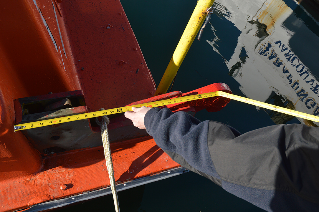 3. TSB investigators taking pertinent measurements of the occurrence lifeboat 
