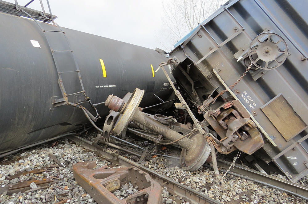 Derailed cars on their side