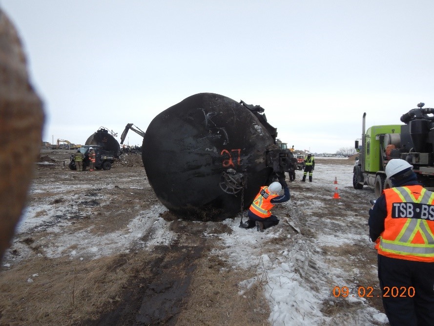 TSB (foreground) and NTSB personnel examining the accident site (Source TSB)
