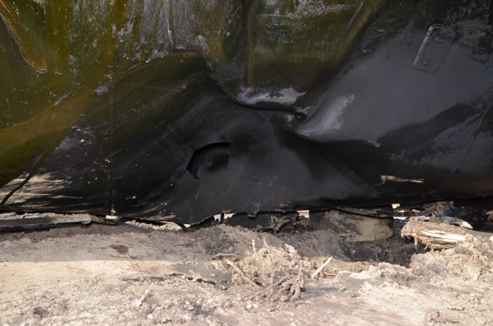 Image of Tank car TILX 316613, puncture in top of shell, as decribed in text