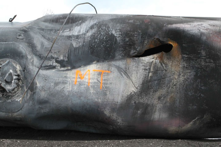 Image of Tank car WFIX 130571, shell puncture, as decribed in text