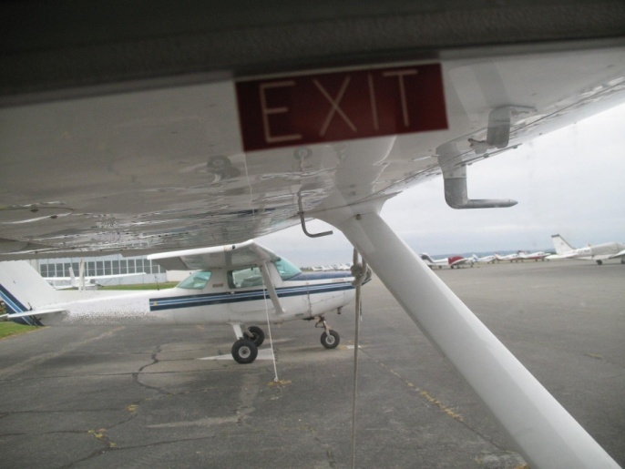 Photo of Picture taken from the inside of a Cessna 150, to illustrate the view from the pilot seat, and how it is partially obstructed by the wing