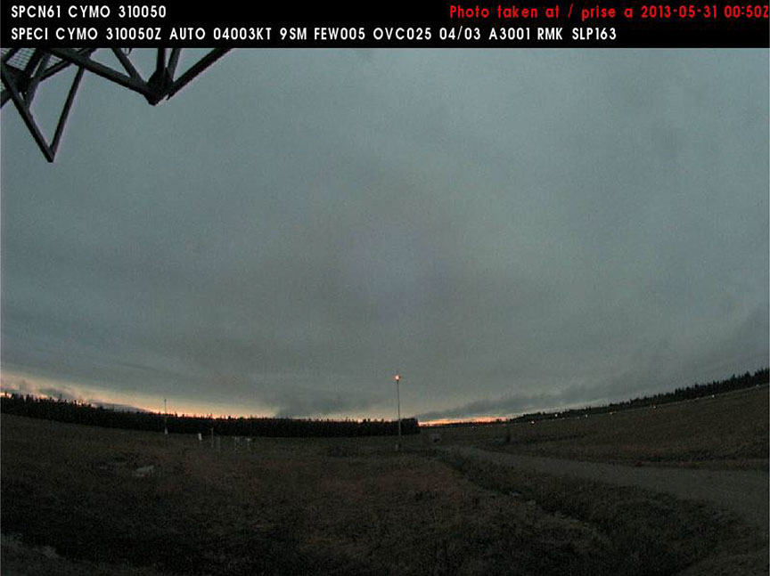 Image taken by the northeast-oriented weather camera showing the lit tower and the treeline at Moosonee Airport at 2050 on 30 May 2013