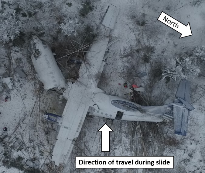 Photo of aircraft wreckage, as seen from above (Source: Royal Canadian Mounted Police, with TSB annotations)