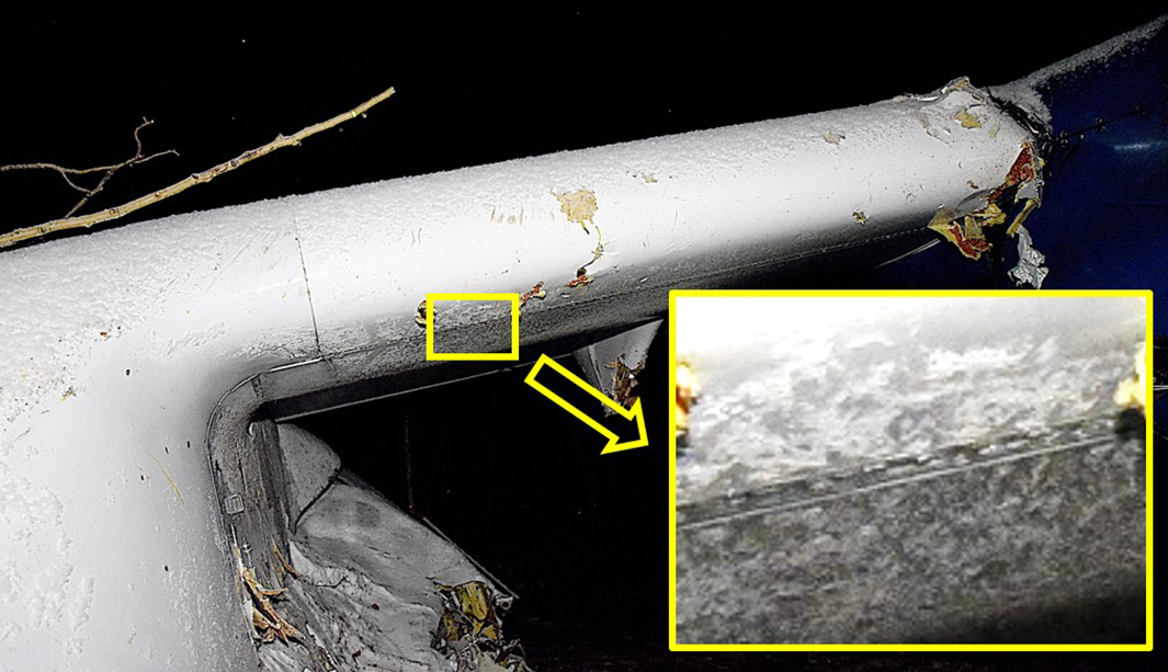 Photo of inner left wing with inset image showing surface contamination on lower leading edge (Source: Royal Canadian Mounted Police, with TSB annotations)
