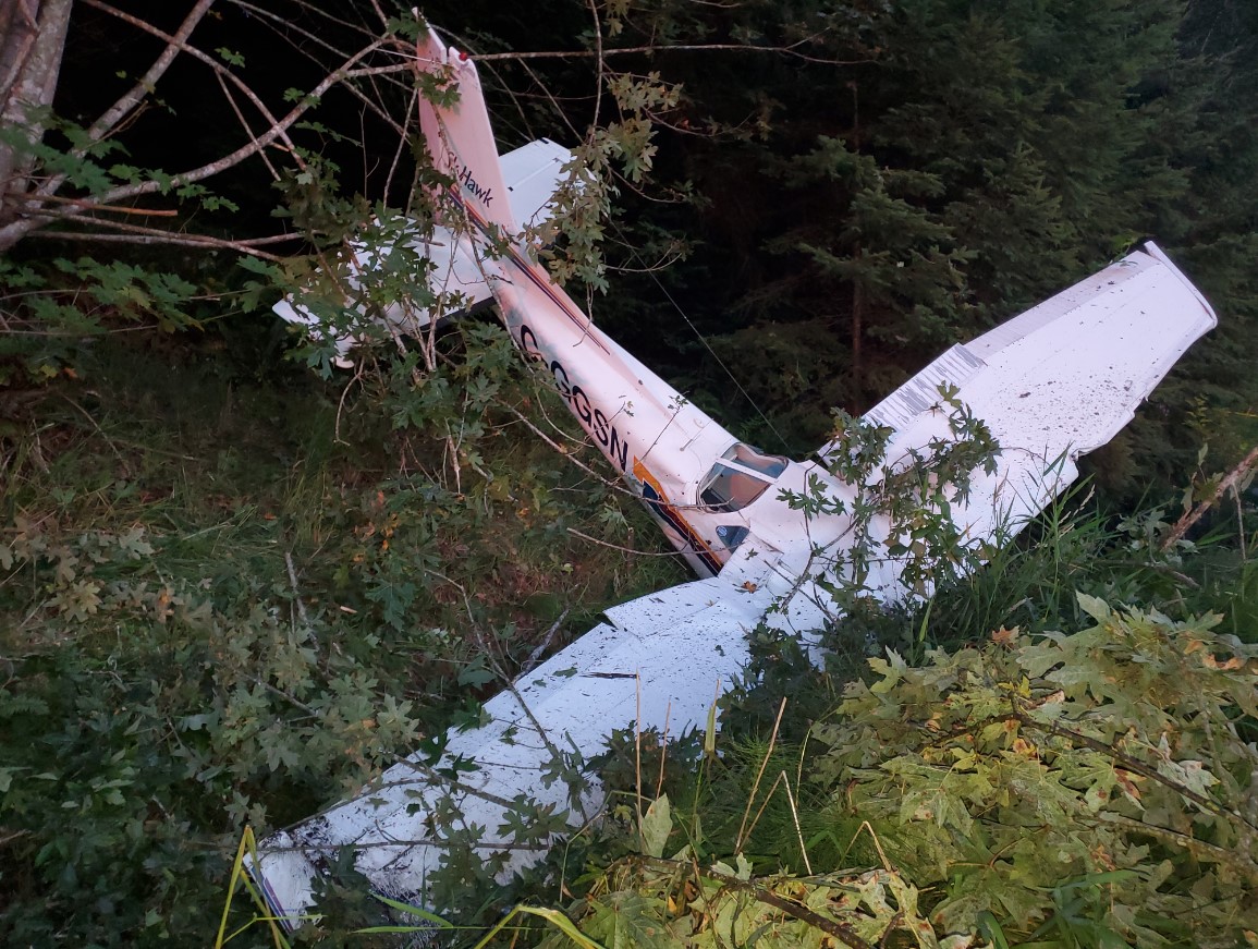 Accident site, approximately 1880 feet east-southeast of the end of Runway 11 (Source: Parksville Fire Department)