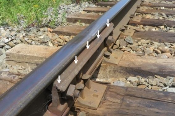 Photo of damaged rail joint bar due to contact with wheel flanges