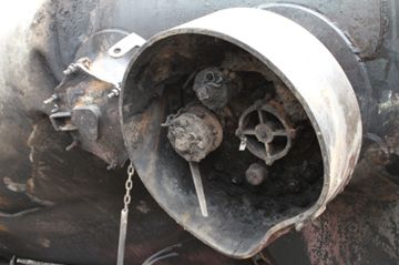 Photo of the protective housing providing top discontinuity protection for tank car fittings