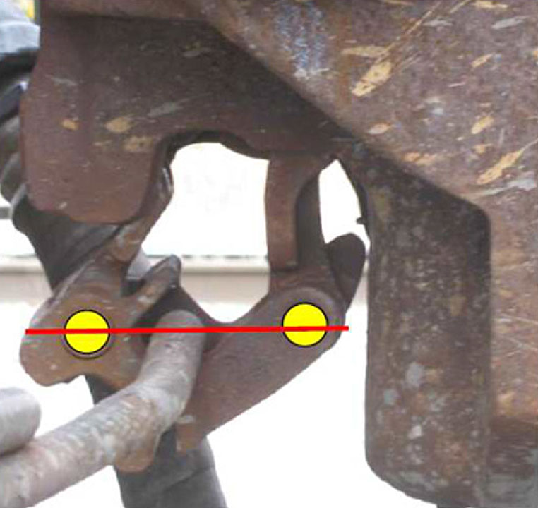 Proper alignment of the lock-lift assembly pivot points in a bottom-operated lock