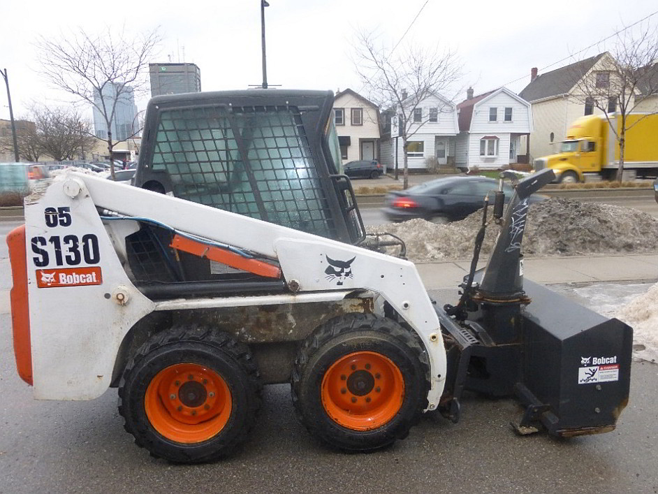   Bobcat S130 skid-steer loader equipped with a blower (Source:  TSB)