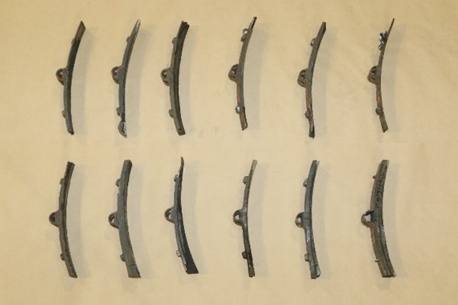 Twelve of the recovered locomotive brake shoes (Source: TSB