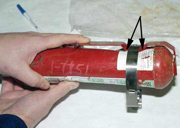 Recovered Halon extinguisher - Exhibit 1-7151 - impact mark aligned with typical support bracket