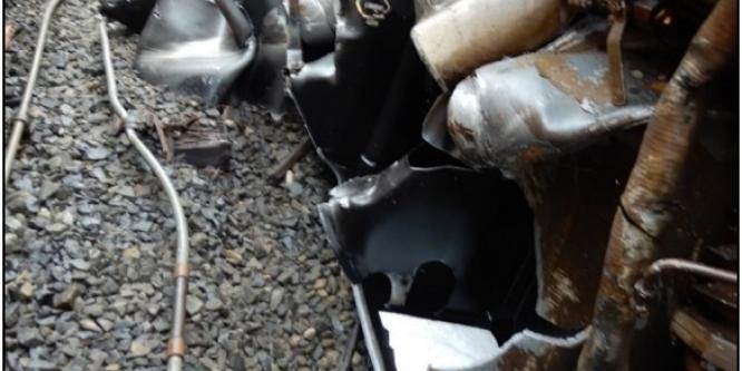 Figure 4. Severely damaged fuel tank on the lead locomotive of train 804 (Source: TSB)