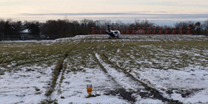 <h2>Temperature drop caused a wet runway surface to freeze, resulting in a runway overrun in Kingston, Ontario</h2>